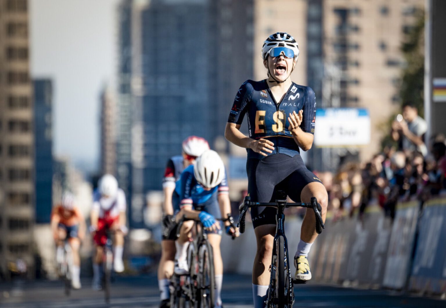 Alejandra Neira celebrates at the finish of the World Junior Road Race Championships in Montreal